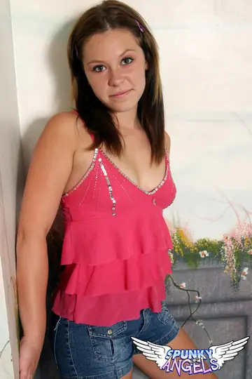 Woman in Shorts Covers Her Pierced Nipples with Her Fingers