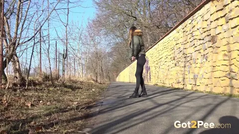 Cynthia Vellons: Slim Blonde MILF in Boots Pisses on Paved Road – photo 13 of 15