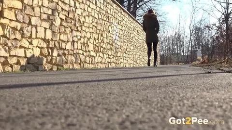 Cynthia Vellons: Slim Blonde MILF in Boots Pisses on Paved Road – photo 15 of 15