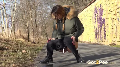 Cynthia Vellons: Slim Blonde MILF in Boots Pisses on Paved Road – photo 12 of 15