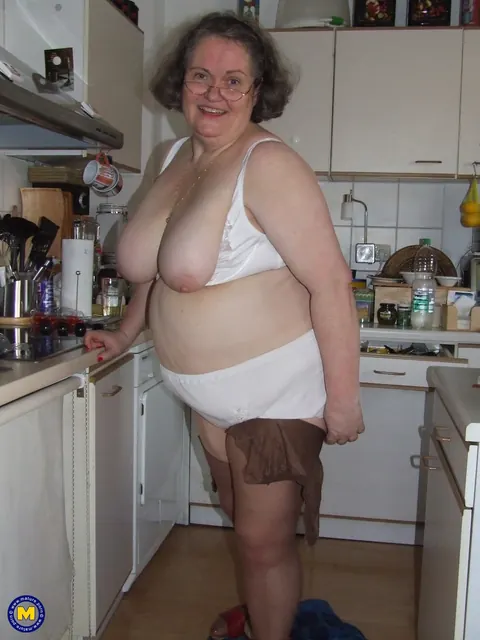 Birgid: Busty Curvy Mature Woman Masturbates with a Cucumber on the Kitchen Counter – photo 8 of 20