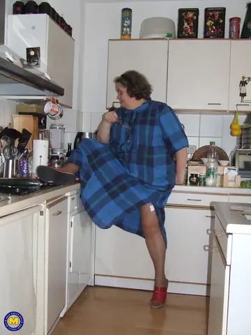 Birgid – Busty Curvy Mature Woman Masturbates with a Cucumber on the Kitchen Counter