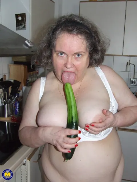 Birgid: Busty Curvy Mature Woman Masturbates with a Cucumber on the Kitchen Counter – photo 11 of 20