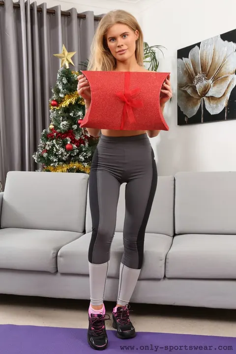 Thick European Blonde Poses Topless in Yoga Pants on the Sofa – photo 16 of 21