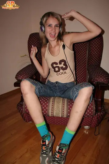 Blonde with Small Natural Tits Strips Down to Her Socks and Spreads