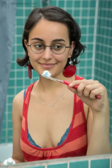 Short-Haired Brunette with Hairy Pussy Fingers Herself in the Bathroom