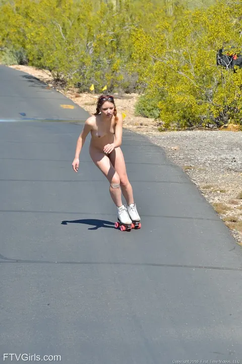 Woman Roller Skates Nude in a Skirt Outdoors – photo 19 of 20