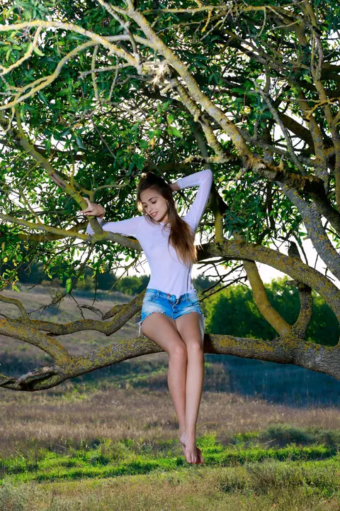 Elle Tan: Slim Russian Brunette Strips Out of Her Shorts at Sunset – photo 2 of 21