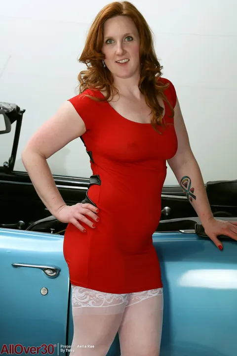 Aella Rae: Busty Redhead MILF Strips and Spreads in a Convertible – photo 2 of 16