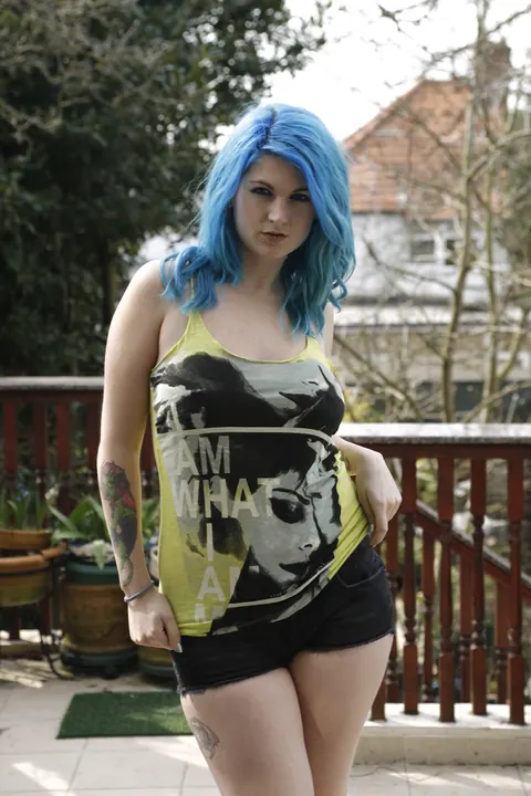 Emma Black: Busty European Babe Strips Out of Her Shorts on the Balcony – photo 1 of 16