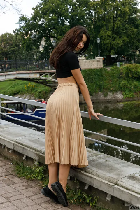Miki Pedangen: Amateur Brunette Poses in a Skirt and Flashes Her Panties Outdoors – photo 7 of 12