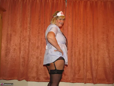 Curvy MILF Strips Out of Her Nurse Uniform into Lingerie – photo 5 of 16
