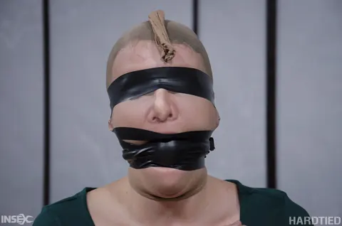 Kel Bowie: Redhead Bound and Gagged in a Skirt for BDSM – photo 3 of 14