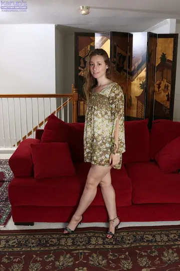 Slim Brunette in a Skirt and Heels Shows Her Hairy Pussy