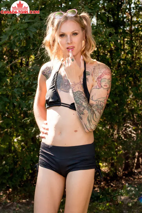 Tattooed Trans Woman Stands Nude Outdoors and Strokes Her Cock – photo 1 of 16