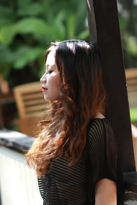 Petite Asian Woman Shows Her Legs in a Dress Outdoors – photo 14 of 21