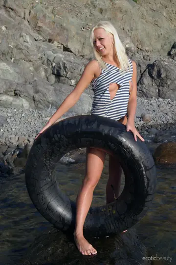 Blonde PAWG Undresses and Poses Nude on the Beach