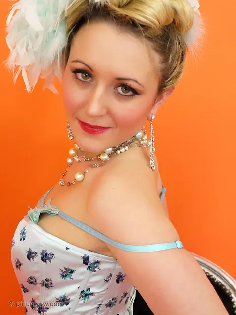 Thick Pinup Model Strips Out of Her Corset and Models White Fishnet Lingerie – photo 10 of 17