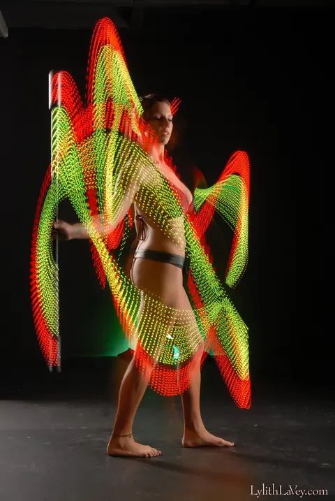 Lylith Lavey: Busty Brunette Poses in Lingerie Under a Light Show – photo 11 of 21