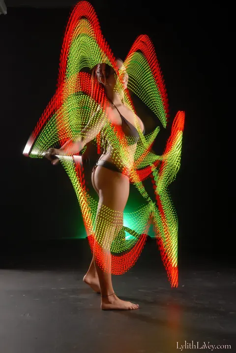 Lylith Lavey: Busty Brunette Poses in Lingerie Under a Light Show – photo 10 of 21