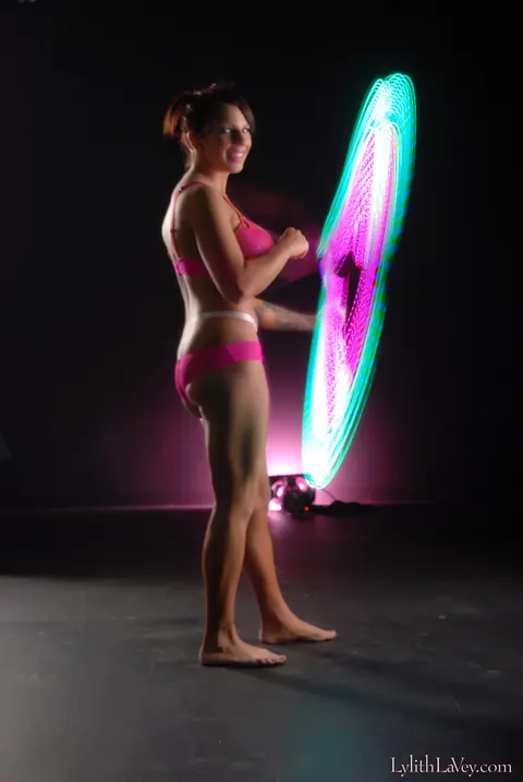 Lylith Lavey: Busty Brunette Poses in Lingerie Under a Light Show – photo 17 of 21