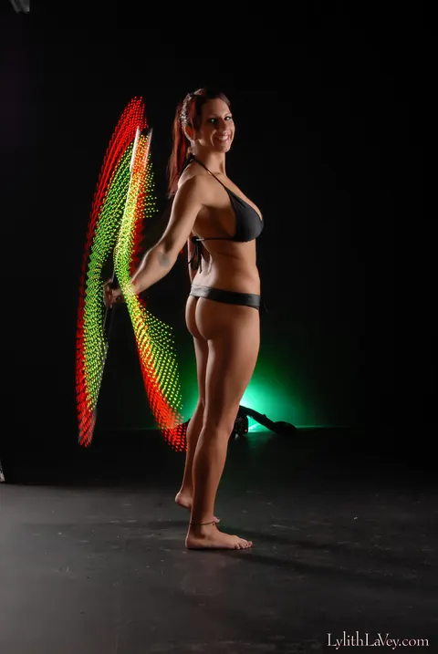 Lylith Lavey: Busty Brunette Poses in Lingerie Under a Light Show – photo 6 of 21