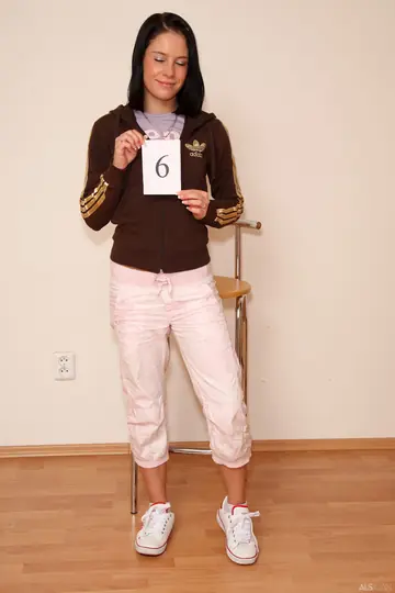 Slim Tattooed Brunette Spreads Her Legs and Shows Her Pussy