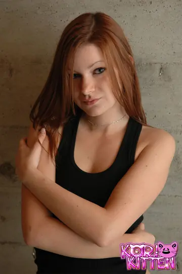 Korina Bliss – Skinny Redhead Covers Her Boobs in a Skirt and Panties