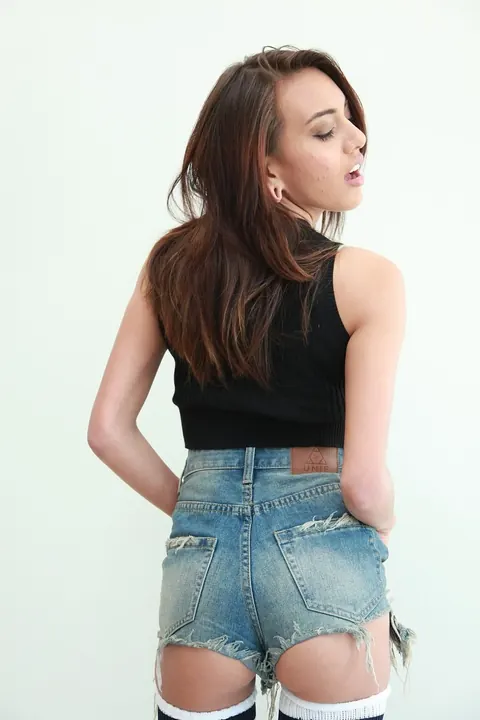 Janice Griffith: Petite Brunette in Stockings and Shorts Shows Her Natural Tits – photo 14 of 15