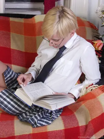 Slim Short-Haired Blonde in Uniform Strips and Poses