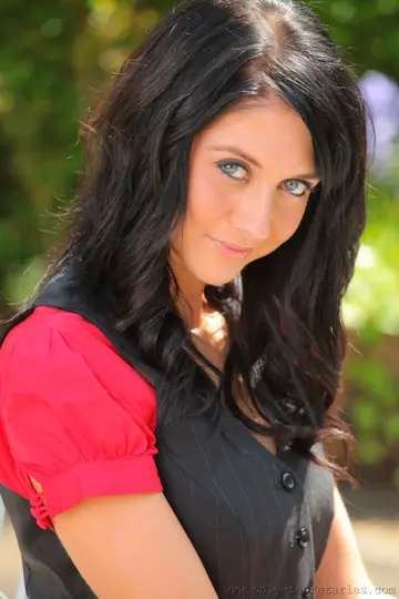 Busty Brunette Sheds Her Secretary Uniform for Lingerie and Stockings Outdoors