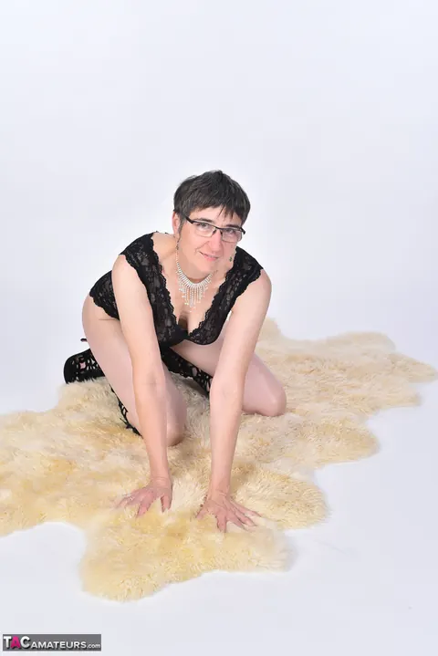 Short-Haired European MILF Strips Nude on a Bearskin Rug – photo 5 of 16