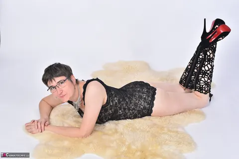Short-Haired European MILF Strips Nude on a Bearskin Rug – photo 12 of 16