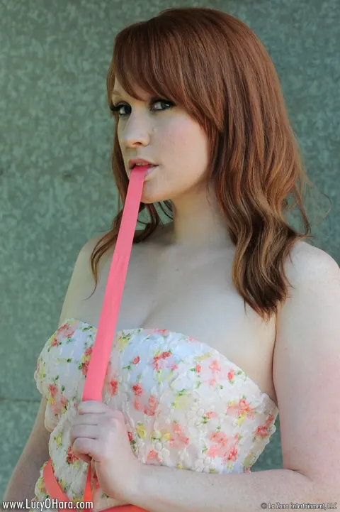 Lucy OHara: Busty Redhead Plays with a Dildo in Her Shorts Outdoors – photo 7 of 15