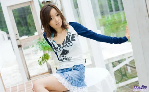 Asian Brunette in a Skirt and Bikini Pulls Down Her Panties – photo 3 of 16