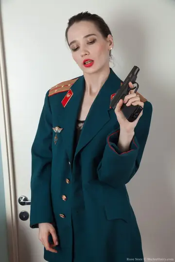 Russian Brunette Strips Out of Her Police Uniform to Show Her Hairy Pussy