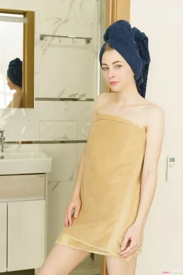 Slim Blonde Sheds Her Robe and Fingers Her Pussy