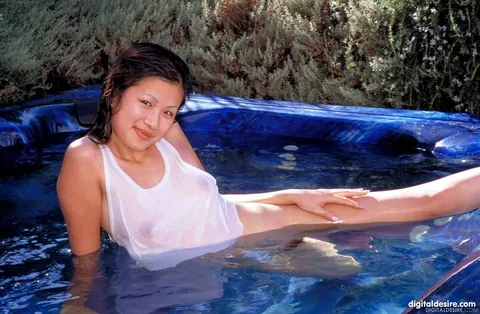 Jennifer Lee: Asian Brunette with Enhanced Tits Spreads Her Hairy Pussy by the Pool – photo 3 of 21