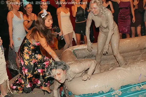 Woman Wrestles Opponent in Mud Pit – photo 7 of 15