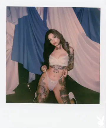 Brunette with Natural Tits and Tattoos Poses Fully Nude