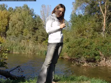 Woman in Jeans Spreads Her Shaved Pussy Outdoors