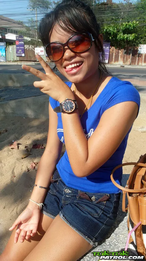 Thai Beauty in Glasses Strips and Spreads Outdoors – photo 1 of 20