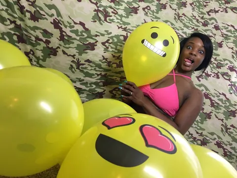 Kassey Starr: Ebony Brunette Shows Off Cleavage with a Balloon Outdoors – photo 16 of 18