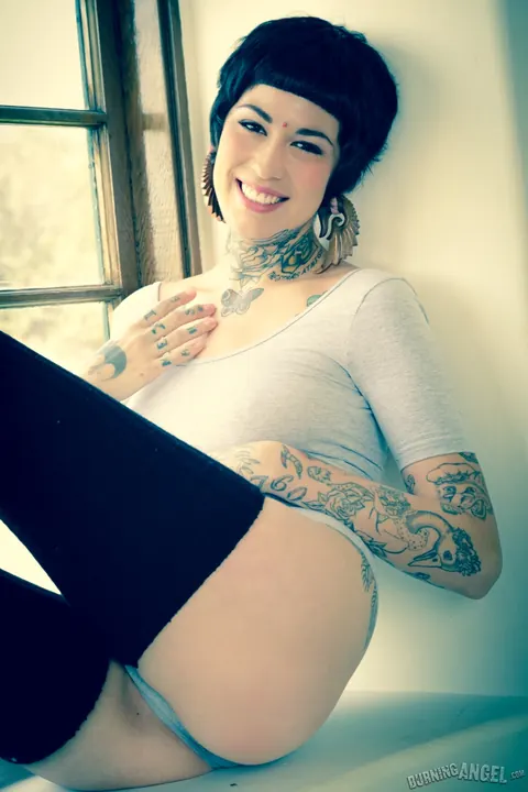 Short-Haired Babe with Big Tits Spreads in a Bodysuit – photo 1 of 17