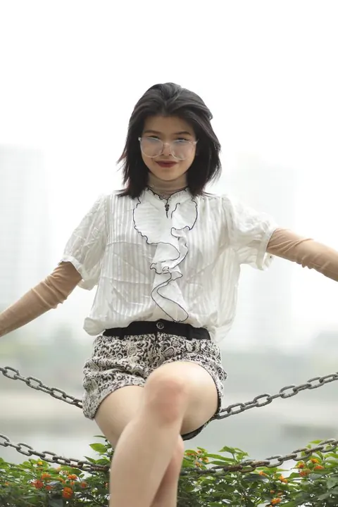 Asian Brunette in Glasses Poses Outdoors in Shorts – photo 8 of 21