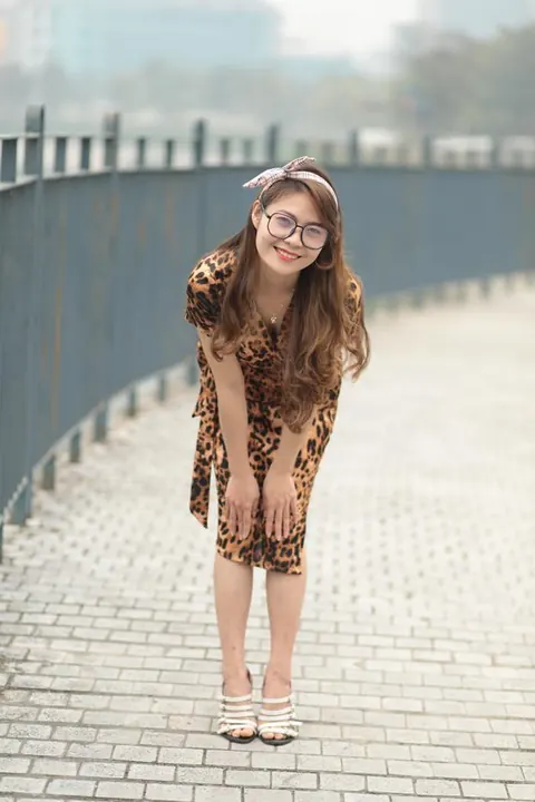 Asian Woman in a Skirt and Glasses Poses Outdoors – photo 8 of 21