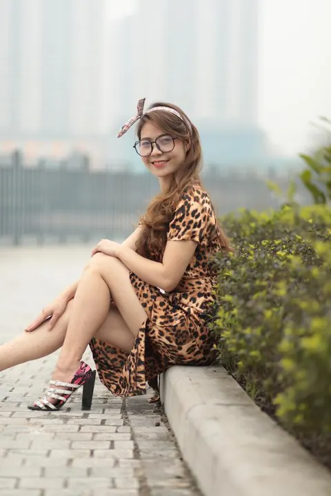 Asian Woman in a Skirt and Glasses Poses Outdoors – photo 6 of 21