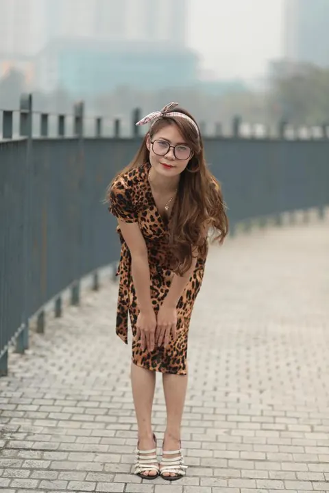 Asian Woman in a Skirt and Glasses Poses Outdoors – photo 12 of 21
