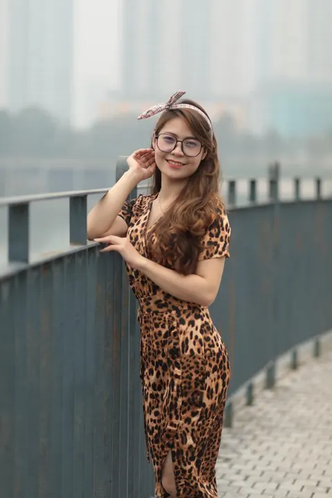 Asian Woman in a Skirt and Glasses Poses Outdoors – photo 19 of 21