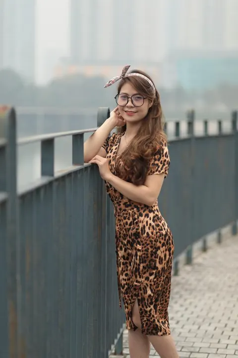 Asian Woman in a Skirt and Glasses Poses Outdoors – photo 15 of 21